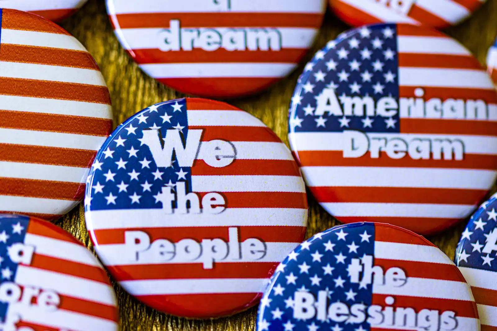 We the people buttons with american flags on them